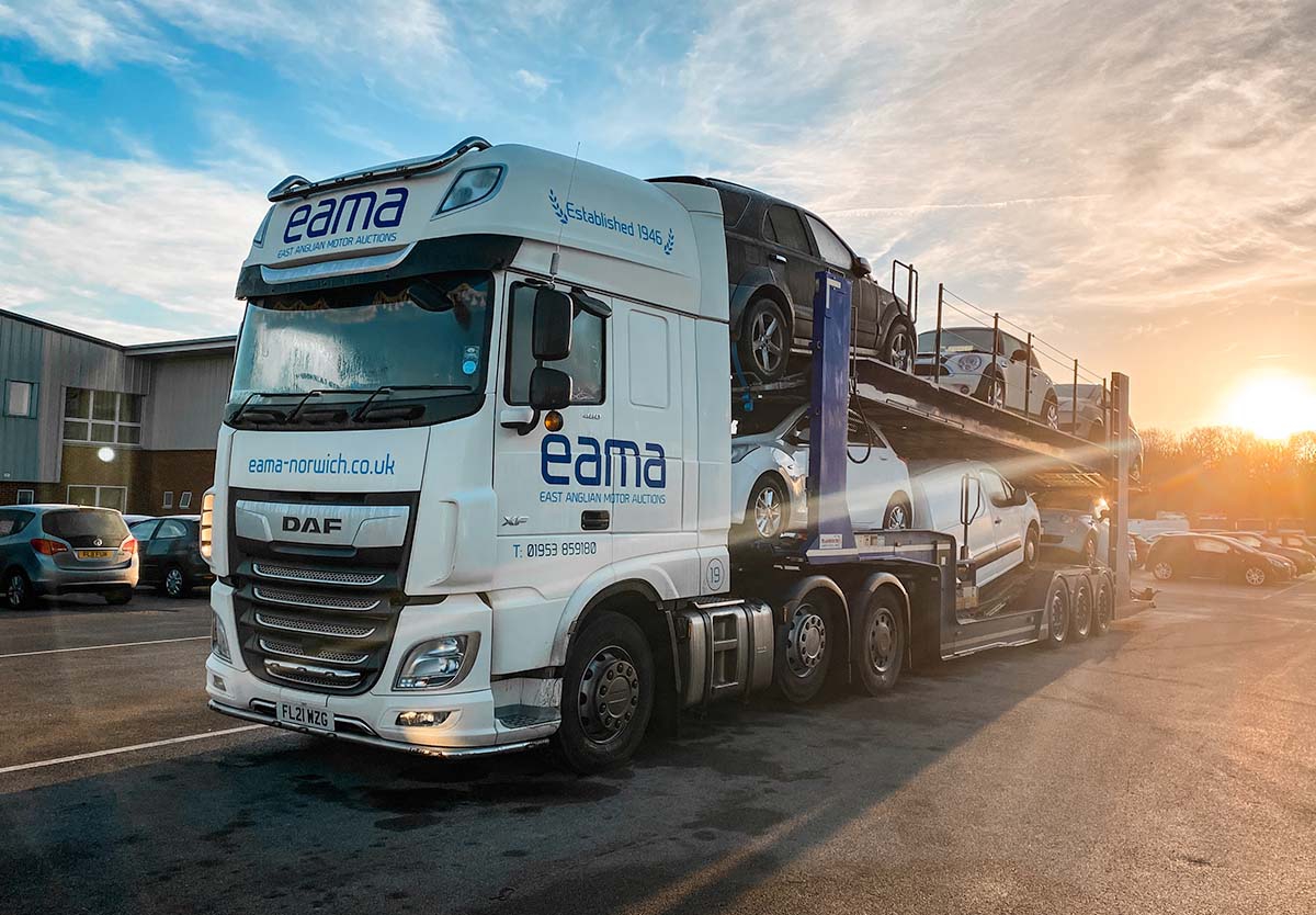 car transporter at sunset