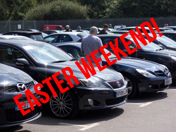 auction car lot with attendees and EASTER WEEKEND! banner over the top
